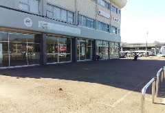 The subject property is situated on Josiah Gumede (Old Main) Road – Pinetown. The immediate area comprises of international automotive dealerships, retail and commercial type properties. A corner property, the subject offers double road frontage and a well balanced tenant mix. A two- storey building with access being gained off both Josiah Gumede and Mason Road – this includes drive up ramp access to the upper floors.
